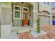 Front entrance with orange door and brick walkway at 2599 Nouveau Way, Kissimmee, FL 34741