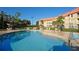Inviting community pool with ample deck space for lounging at 6336 Parc Corniche Dr # 3303, Orlando, FL 32821