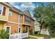 Townhouse exterior with charming details and a white picket fence at 2601 Gala S Rd # 107, Kissimmee, FL 34746