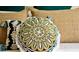Close-up of decorative pillows with gold and green embroidery at 2601 Gala S Rd # 107, Kissimmee, FL 34746