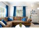 Inviting living room with comfortable brown sectional sofa, blue throw pillows, and decorative accents at 2601 Gala S Rd # 107, Kissimmee, FL 34746