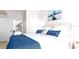 Spacious main bedroom with white and blue bedding, matching nightstands, and ensuite bathroom access at 2601 Gala S Rd # 107, Kissimmee, FL 34746