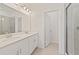 Double vanity bathroom with separate shower and linen closet at 707 Southern Edge Way, Sanford, FL 32771