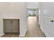 Bright hallway with light gray cabinets and wood-look floors at 707 Southern Edge Way, Sanford, FL 32771