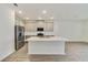 Modern kitchen with island and stainless steel appliances at 707 Southern Edge Way, Sanford, FL 32771