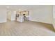 Spacious living room with wood-look floors and access to patio at 707 Southern Edge Way, Sanford, FL 32771