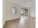 Bright living room with sliding doors to patio at 707 Southern Edge Way, Sanford, FL 32771