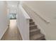 Modern staircase with light walls and carpeted steps at 707 Southern Edge Way, Sanford, FL 32771