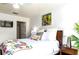 Tropical-themed bedroom with a king bed and en-suite bathroom at 2601 Gala S Rd # 107, Kissimmee, FL 34746