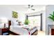 Bedroom with king bed, tropical art, and plenty of natural light at 2601 Gala S Rd # 107, Kissimmee, FL 34746