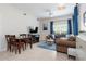Spacious living room with sectional sofa, dining area, and blue accents at 2601 Gala S Rd # 107, Kissimmee, FL 34746