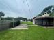 Large backyard with carport and home's back exterior at 2815 N Leavitt Ave, Orange City, FL 32763