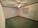Bright bedroom featuring two windows and ceiling fan at 2815 N Leavitt Ave, Orange City, FL 32763
