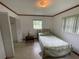 Charming bedroom with a double bed and side table at 2815 N Leavitt Ave, Orange City, FL 32763