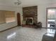 Living room with brick fireplace and tiled floors at 2815 N Leavitt Ave, Orange City, FL 32763