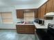 Kitchen with wood cabinets, stainless steel appliances and tiled floors at 2815 N Leavitt Ave, Orange City, FL 32763