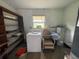 Laundry room with washer, dryer, and shelving at 2815 N Leavitt Ave, Orange City, FL 32763