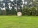 Large backyard with a shed and lush green grass at 2815 N Leavitt Ave, Orange City, FL 32763