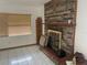 Living room with brick fireplace and tiled floors at 2815 N Leavitt Ave, Orange City, FL 32763
