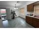 Kitchen with wood cabinets, stainless steel appliances and tiled floors at 2815 N Leavitt Ave, Orange City, FL 32763