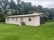 Back exterior view of home with AC unit at 2815 N Leavitt Ave, Orange City, FL 32763