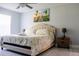 King-size bed and wall-mounted TV in a bright bedroom at 5009 Laguna Bay Cir # 41, Kissimmee, FL 34746