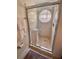 Shower with a round window and marble tile at 5009 Laguna Bay Cir # 41, Kissimmee, FL 34746