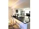 Modern kitchen with stainless steel appliances and breakfast bar at 5009 Laguna Bay Cir # 41, Kissimmee, FL 34746