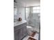 Clean bathroom with gray vanity and marble shower at 5009 Laguna Bay Cir # 41, Kissimmee, FL 34746