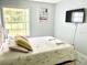 Bedroom with queen bed and large window at 5009 Laguna Bay Cir # 41, Kissimmee, FL 34746