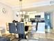 Modern dining room with glass table and six chairs at 5009 Laguna Bay Cir # 41, Kissimmee, FL 34746