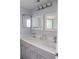 Bathroom with double vanity and gray cabinets at 5009 Laguna Bay Cir # 41, Kissimmee, FL 34746