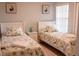 Twin bedroom with two beds and shared nightstand at 5009 Laguna Bay Cir # 41, Kissimmee, FL 34746
