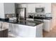 Modern kitchen with stainless steel appliances and dark countertops at 5009 Laguna Bay Cir # 41, Kissimmee, FL 34746