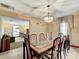 Bright dining room with a large table and built-in hutch at 4711 County Road 134, Wildwood, FL 34785