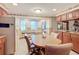 Kitchen with granite countertops and wood cabinets, breakfast nook at 4711 County Road 134, Wildwood, FL 34785
