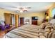Main bedroom with hardwood floors and ensuite bathroom access at 4711 County Road 134, Wildwood, FL 34785