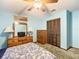 Bedroom with wood furniture, ceiling fan, and dresser at 4711 County Road 134, Wildwood, FL 34785