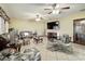 Bright living room with large TV and comfortable seating at 4711 County Road 134, Wildwood, FL 34785