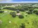 Aerial view showcasing house and expansive land at 4711 County Road 134, Wildwood, FL 34785