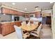Kitchen with granite countertops and wood cabinets, breakfast nook at 4711 County Road 134, Wildwood, FL 34785