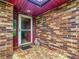 Front door entry with brick accents at 4711 County Road 134, Wildwood, FL 34785