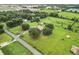 Aerial view of property showing house and road at 4711 County Road 134, Wildwood, FL 34785