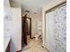 Clean bathroom with toilet, shower, and built-in shelving at 4711 County Road 134, Wildwood, FL 34785