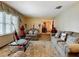 Comfortable living room with two sofas and a view into the dining room at 4711 County Road 134, Wildwood, FL 34785