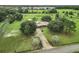 Aerial view of property showing house and road at 4711 County Road 134, Wildwood, FL 34785