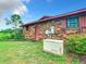 Brick home with Generac generator and manicured lawn at 4711 County Road 134, Wildwood, FL 34785