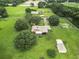 Aerial view of house and expansive property at 4711 County Road 134, Wildwood, FL 34785