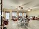 Relaxing living room with wicker furniture and ceiling fans at 4711 County Road 134, Wildwood, FL 34785