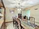 Bright dining room with a large table and built-in hutch at 4711 County Road 134, Wildwood, FL 34785